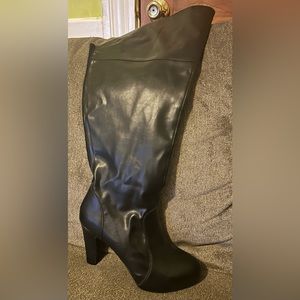 Torrid over the knee high heeled boots.